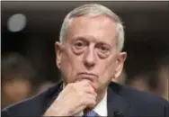  ?? THE ASSOCIATED PRESS ?? Defense Secretary-designate James Mattis listens to questions from Sen. Kirsten Gillibrand, D-N.Y., about his views on women and gays serving in the military, during his confirmati­on hearing before the Senate Armed Services Committee on Thursday on...