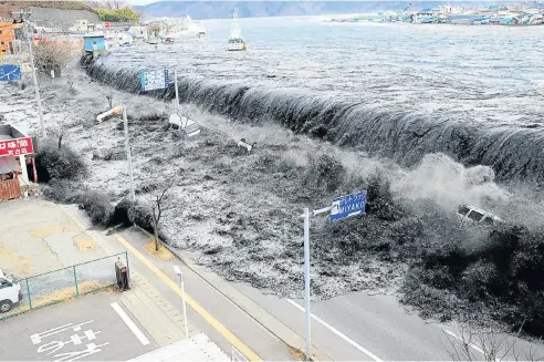  ?? Picture: Reuters ?? A gigantic wave approaches Miyako City from the Heigawa estuary after a magnitude-9.0 earthquake struck Japan on March 11 2011. The earthquake and the resulting tsunami triggered the meltdown of three reactors at Japan’s Fukushima Daiichi power plant, the worst nuclear accident since the Chernobyl disaster in 1986.