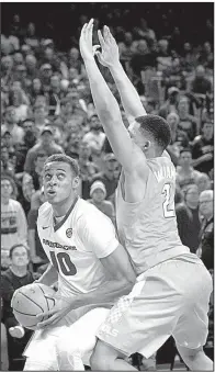  ?? NWA Democrat-Gazette/CHARLIE KAIJO ?? Arkansas forward Daniel Gafford looks to take a shot against Tennessee forward Grant Williams during the Razorbacks’ victory Saturday in Fayettevil­le. Gafford finished with 15 points and gamehighs of 8 rebounds and 5 blocked shots in 33 minutes.