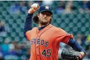  ?? Elaine Thompson / Associated Press ?? Gerrit Cole finished with 11 strikeouts in six innings Sunday as he earned his first victory of the season.