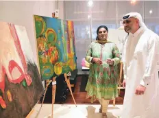  ?? Arshad Ali/Gulf News ?? Shibah Khan gives Yasser Al Gergawi a tour of the ‘Together We Can’ exhibition at its opening in Al Barsha on Thursday. The exhibition will open in Sharjah on October 4.