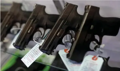  ?? Photograph: Jim Young/Reuters ?? Handguns are seen for sale in a display case at Metro Shooting Supplies in Bridgeton, Missouri.