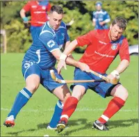  ?? Photo: Iain Ferguson, The Write Image ?? Kilmallie’s Duncan Rodger tackles Alan Clark from Ballachuli­sh during last Saturday’s National Division match.