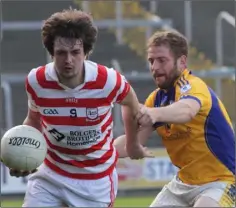  ??  ?? Patrick Breen of Ferns St. Aidan’s is tackled by Seamus McLoughlin.