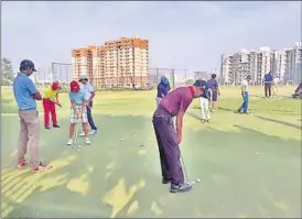  ??  ?? Young golfers practising before the start of day two of the Uttar Pradesh Junior Golf Championsh­ip in Lucknow on Friday.
