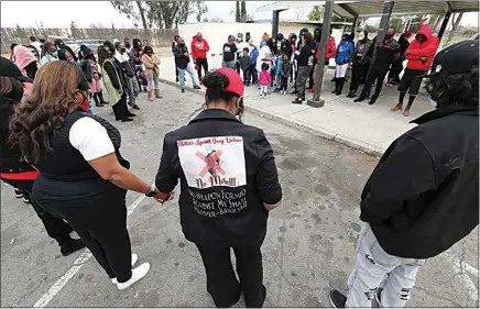  ??  ?? A prayer vigil was held at Wayside Park in south Bakersfiel­d for Sha Neva Riley, a mom of four children, who was brutally shot and killed at the park last weekend.