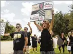  ?? JAMES WOOLDRIDGE / THE PALM BEACH POST ?? On Thursday, Karen Weissler and others protest Brett Kavanaugh near Sen. Marco Rubio’s PGA Boulevard office.