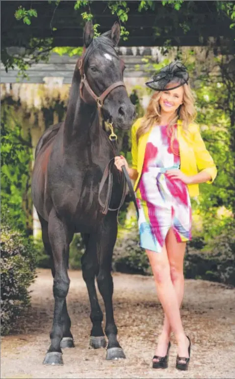  ?? Photo: MITCH BEAR ?? ON TREND: Geelong Miss Universe contestant Sarah Czarmuch follows all the fashion rules by wearing bright colours, a jacket and wedge shoes. She is pictured with horse Izba at Gnarwarre’s Rosemont stud.
