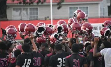  ?? (Pine Bluff Commercial/I.C. Murrell) ?? Pine Bluff High School football players break out of a huddle to end a practice earlier this month. The Zebras are set to host White Chapel tonight at 7 at Jordan Stadium.