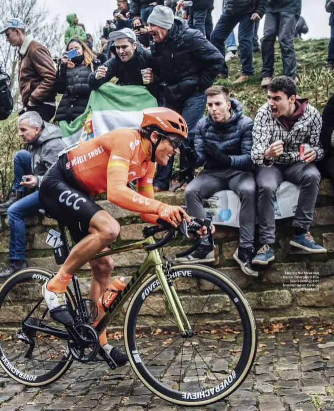  ??  ?? Tackling the Muur van Geraardsbe­rgen at this year’s Omloop Het Nieuwsblad on classics opening weekend