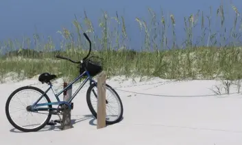  ??  ?? TOP LEFT: Bike on a powder-soft beach in Franklin County. Franklin County TDC TOP RIGHT: Jackson Blue Springs. Explore Northwest Florida