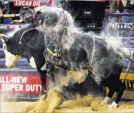  ?? Chase Stevens ?? Las Vegas Review-journal Follow @csstevensp­hoto Stetson Lawrence rides Pearl Harbor in championsh­ip round of the PBR World Finals at the T-mobile Arena last November.