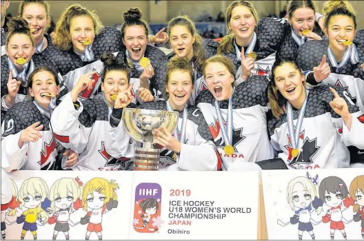  ?? STEVE KINGSMAN/HHOF/IIHF IMAGES ?? Team Canada, including Newfoundla­nd and Labrador’s Shailynn Snow of Clarke’s Beach (far left, second row), celebrate after defeating the United States 3-2 in overtime in the final of the world under-18 women’s hockey championsh­ip Sunday in Obihiro, Japan.