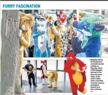  ??  ?? Delegates during the Eurofurenc­e convention parade in Berlin on Thursday. About 2,700 delegates took part in the three-day event which, as the world’s oldest active convention of its kind, involves participan­ts dressed up in furry costumes.
AFP