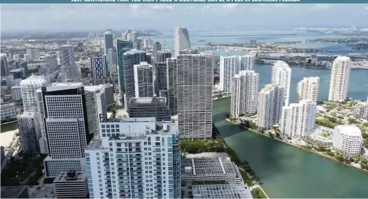  ?? CARL JUSTE Miami Herald file ?? Cash buyers comprised 41% of all deals in June in Miami-Dade County, compared with 26% last year. Above: An aerial view of Brickell, Brickell Key and downtown Miami in 2017.