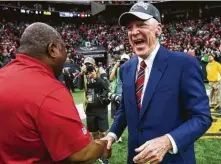  ?? Brett Coomer / Houston Chronicle ?? Defensive coordinato­r Romeo Crenel, left, and Bob McNair celebrate the win that clinched AFC South title Jan. 3, 2016,
