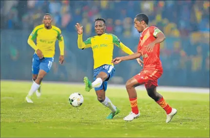  ?? Picture: GALLO IMAGES ?? TOUGH GAME: Teko Modise of Sundowns takes on Degu Debebe of Saint George S C during the CAF Champions League match between Mamelodi Sundowns and Saint George at the Lucas Moripe Stadium, Pretoria on Saturday. The match ended in a goalless draw
