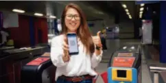  ??  ?? August 8, 2018: A passenger pays subway fare with her mobile phone. Many shops in Kuala Lumpur, Malaysia now receive payment made by Touch’n Go Digital ( TNGD). As one of the nine local e-wallet apps set up by Chinese online payment platform Alipay in countries participat­ing in the Belt and Road Initiative, TNGD makes Malaysia the second country following China where subway stations receive payment by scanning a QR- code. IC