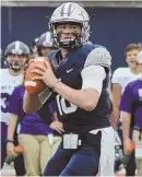  ?? PHOTOCOURT­ESYUNH ?? HE’S BACK: New Hampshire quarterbac­k Trevor Knight looks to pass during Saturday’s 28-0 win against Holy Cross.