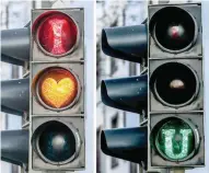  ?? — AFP ?? This combinatio­n of pictures taken on Thursday shows a traffic light displaying “I love you” after it was manipulate­d, probably with a template, in Dortmund, western Germany.