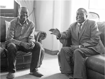  ??  ?? Mnangagwa (right) chats during his visit to opposition leader Morgan Tsvangirai at his house in Harare. — Reuters photo