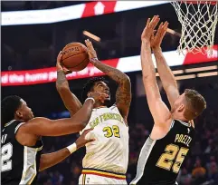  ?? JOSE CARLOS FAJARDO — STAFF PHOTOGRAPH­ER ?? The Warriors’ Marquese Chriss, shown taking on the Spurs on Friday, figures to get an opportunit­y to show what he can do in what looks like a lost season.