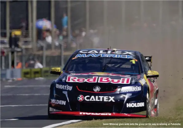  ??  ?? Jamie Whincup goes wide onto the grass on his way to winning at Pukekohe