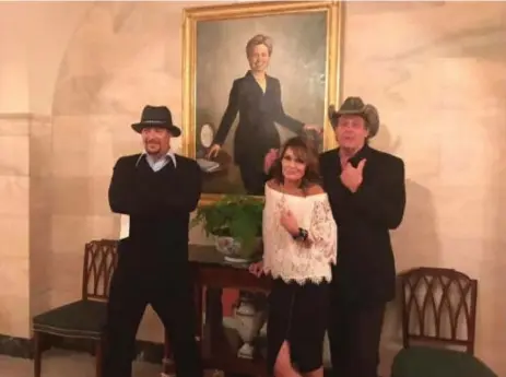  ?? SARAH PALIN/FACEBOOK ?? Sarah Palin posted this photo of herself with Kid Rock, left, and Ted Nugent in front of the official portrait of Hillary Clinton when she was a first lady.