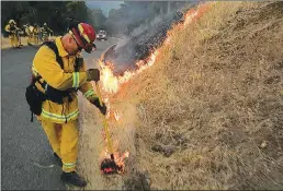  ?? The Press Democrat/tns ?? The County Fire burns along Knoxville-berryessa road on Monday.