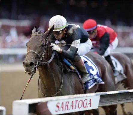  ?? JANET GARGUSO/NYRA ?? Perfect Alibi, trained by Mark Casse and ridden by Irad Ortiz, Jr. races along the rail to captures Sunday’s running of The Spinaway Stakes at Saratoga Race Course.