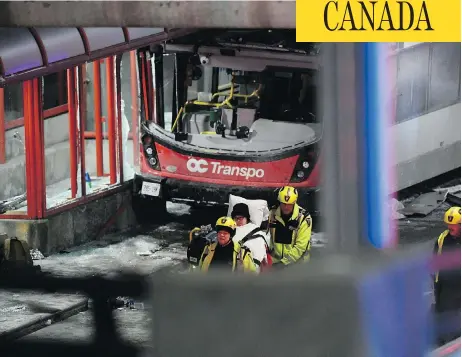  ?? JUSTIN TANG / THE CANADIAN PRESS ?? Police and first responders wheel away a victim after a double-decker city bus struck a transit shelter in central Ottawa on Friday.