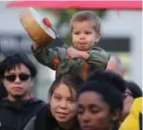  ?? STEVE RUSSELL/TORONTO STAR FILE PHOTO ?? Ohitika Augustine drums and cheers during speeches at Yonge and Dundas Sts. in October as indigenous communitie­s across Canada rallied.