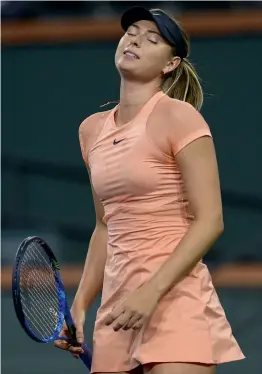  ?? AFP ?? Maria Sharapova reacts in her BNP Paribas Open first round match against Naomi Osaka of Japan in Indian Wells, California, on Wednesday. —