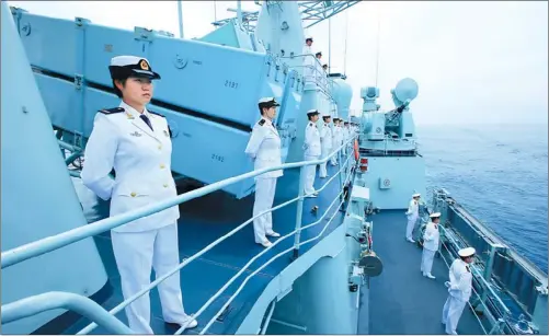  ?? ZHA CHUNMING / XINHUA NEWS AGENCY ?? Soldiers and officials on the Shenyang, a Chinese naval ship, are inspected during the Joint Sea 2013 Drill with Russia in Peter the Great Gulf near Russia’s Far East port city of Vladivosto­k in July. The last of the seven warships that took part in...