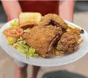  ??  ?? M.K. Davis Restaurant’s side options with fried chicken include fries, salad and Texas toast.