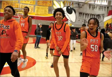  ?? RAY CHAVEZ — STAFF PHOTOGRAPH­ER ?? Pittsburg's Kayshaun Hunte (30) and Tyberius Campos-Reese (50) celebrate their 47-44win over Berkeley in the first round of the North Coast Section Division I playoffs on Tuesday. Pittsburg will host James Logan on Friday.