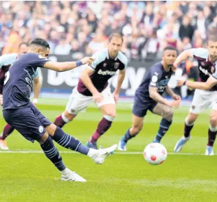  ?? AP ?? Manchester City’s Riyad Mahrez (left) takes a penalty during the English Premier League match between West Ham United and Manchester City at London stadium , The penalty was saved by West Ham’s goalkeeper Lukasz Fabianski.