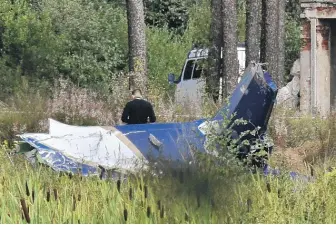  ?? OLGA MALTSEVA/AFP VIA GETTY IMAGES ?? The site of the plane crash in the Tver region of Russia, Thursday.