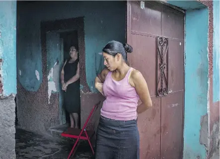  ??  ?? Teresa de Jesus Luna, 55, left, the mother of Denys Adelmo Mejia, and Gilda Lopez, 32, mother to Elizabeth Dayana, in Teresa’s home in the village of Chanmagua, Guatemala.