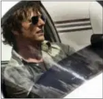  ?? THE ASSOCIATED PRESS ?? This image released by Universal Pictures shows Tom Cruise as Barry Seal in a scene from, “American Made.”