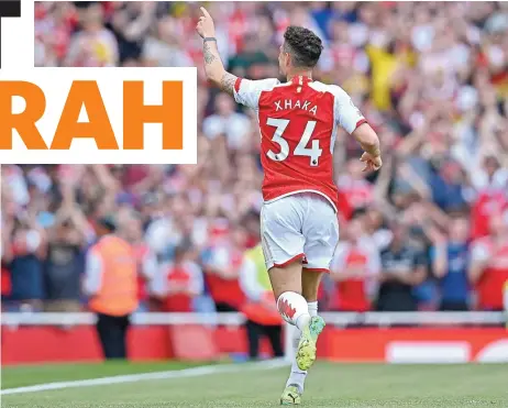  ?? ?? Arsenal's Granit Xhaka celebrates after scoring against Wolves in their English Premier League match on Sunday (AFP)