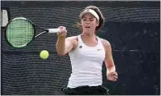  ?? ALEX HORVATH / THE CALIFORNIA­N ?? Kelsey Abraham hits a forehand shot against ClovisBuch­anan’s Laura Hioe in the girls tennis Central Section Division I semifinals on Thursday.