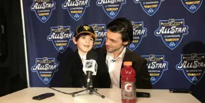  ?? Matt Vensel./Post-Gazette ?? Penguins defenseman Kris Letang and his 7--year-old son, Alex, hold court at the NHL’s All-Star festivitie­s this season in St. Louis. These days, the Letangs are home, and dad’s back aches from hunching over to play mini-sticks with Alex.