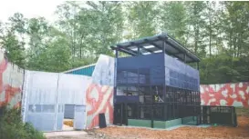  ??  ?? An indoor-outdoor facility called a villa is the new home of chimpanzee­s moved from a research center in Louisiana to Project Chimps, a sanctuary in Morganton, Ga. Soon, perhaps by the end of this year, chimps at the sanctuary are expected to step...