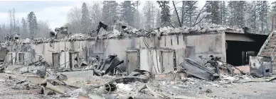  ?? JONATHAN HAYWARD / THE CANADIAN PRESS FILES ?? The provincial state of emergency in Alberta has been lifted, nearly two months after vicious wildfires forced the displaceme­nt of nearly 90,000 people near Fort McMurray and destroyed about 2,400 homes and other buildings.