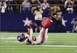  ?? Richard Rodriguez / Getty Images ?? The Giants’ Saquon Barkley is unable to catch a pass during the second half against the Dallas Cowboys at AT&T Stadium on Thursday in Arlington, Texas.