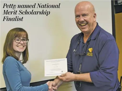  ?? BY HOLLY JENKINS ?? Lauren Petty is congratula­ted by RCHS Principal Jimmy Swindler.