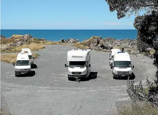  ?? PHOTO: DEREK FLYNN/STUFF ?? These motorhomes were trapped by slips after the Kaikoura earthquake­s. Rental companies are using geo-location technology to keep customers updated in such situations.