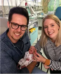  ?? Pictures: PA ?? Our happy family...Stuart and Kim in hospital with tiny Kit, who weighed just 2lb 6oz at birth and, inset, their smiling son today