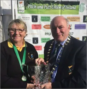  ??  ?? Cathy Richardson receiving her trophy from Mervyn Cooney President of the PPUI last week at the Cement club. Cathy won the Inter Ladies All Ireland Championsh­ip.
